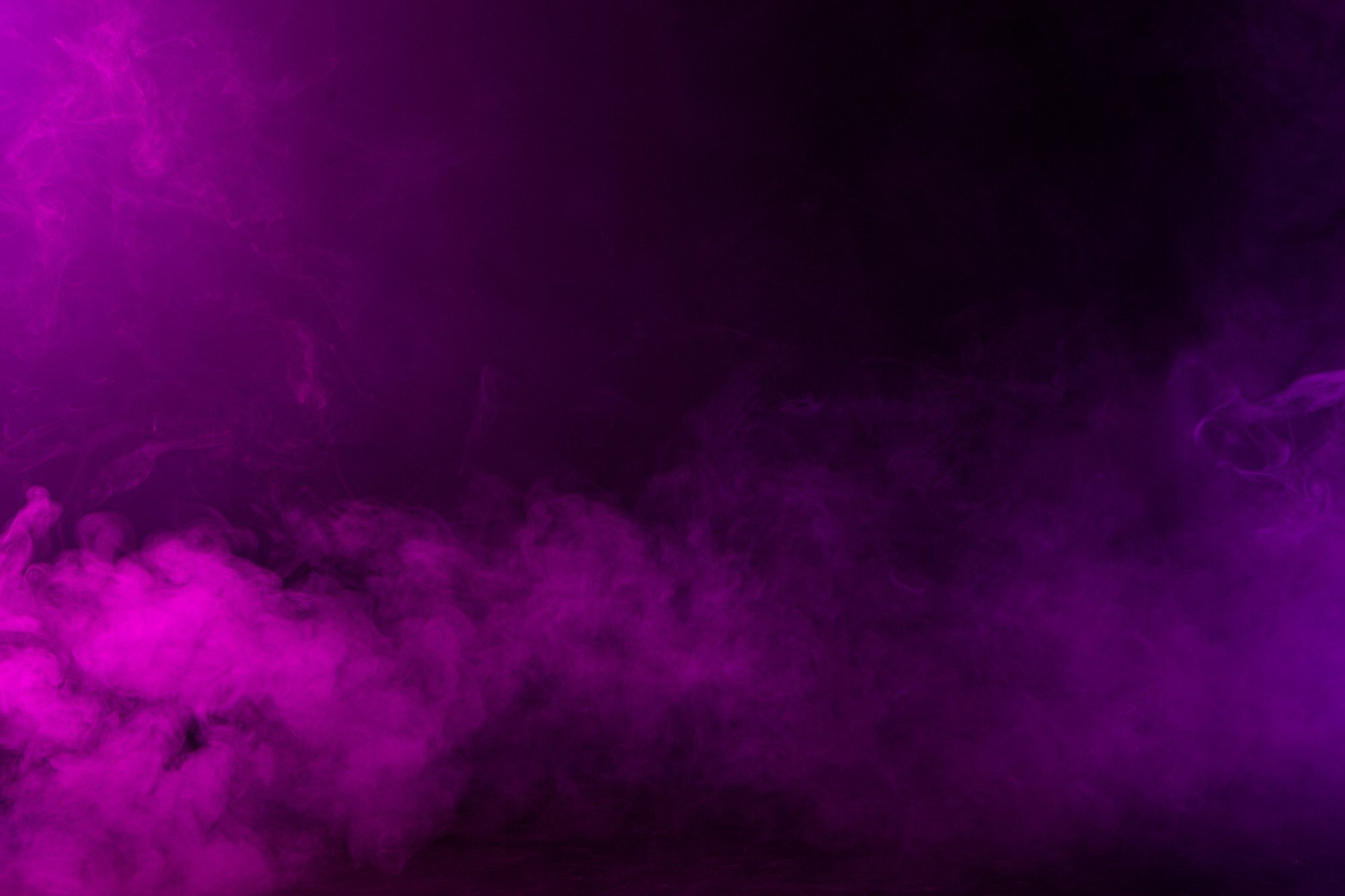 Swirling Pink and Purple Smoke on Black Background